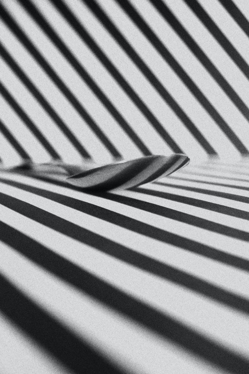 spoon on a surface with black and white stripes